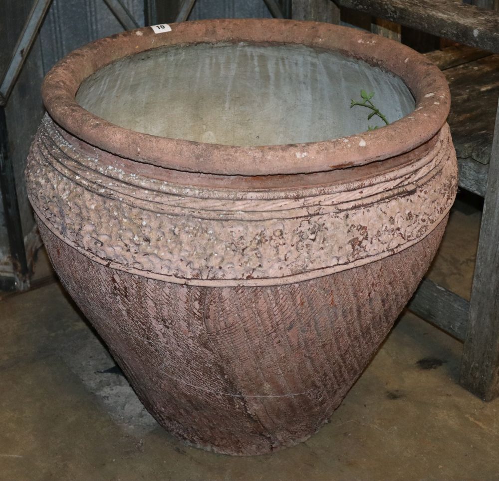 A large incised terracotta garden urn, 64cm diameter, H.60cm